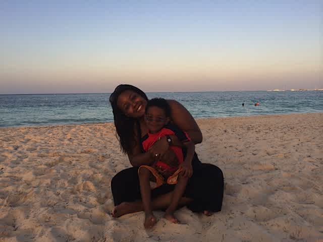 Ericka Souter on the beach with son